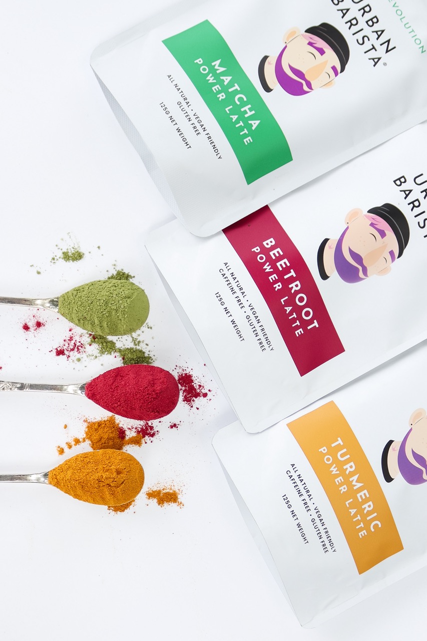 Three pouches of latte mix: matcha, turmeric and beetroot